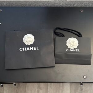 Chanel shopping bags and Camilla